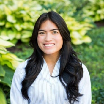 Vietnamese American woman with long black hair, smiling into the camera.